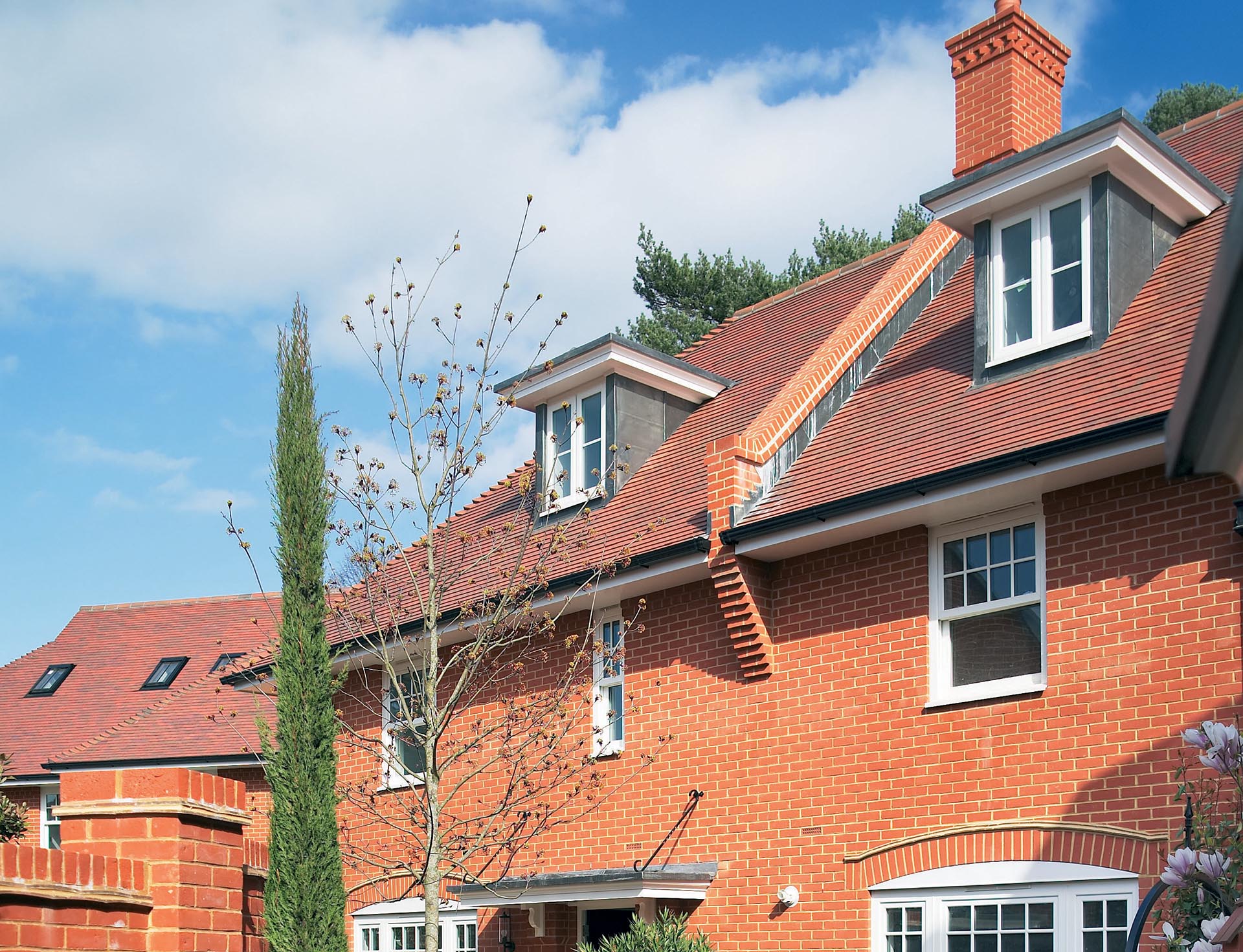 Baillie Park with Red Blue smooth clay roof tiles